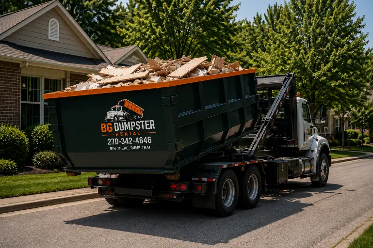 Home 6 Full roll-off dumpster being picked up and hauled away in Bowling Green, KY